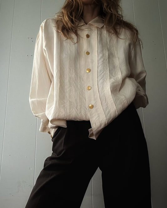 Vintage cream silk blouse, pleated front, gold button closure, worn with black trousers — BB Vintage by Maxine
