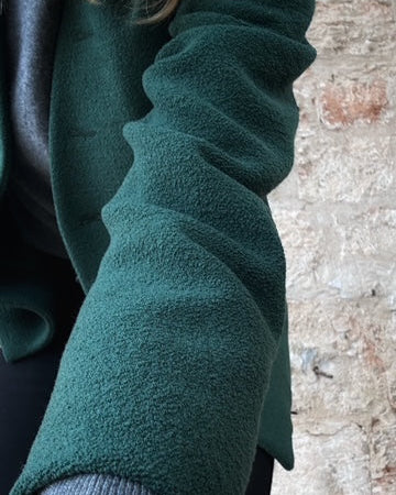 Giorgio Armani vintage blazer fabric close-up, deep forest green